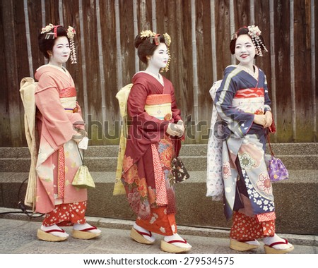 KYOTO March 18 2013 Three beautiful Japanese girls walking down a street in the Gion district of Kyoto Japan a very old traditional city KYOTO March 18 2013 Three beautiful Japanese girls walking down a street in the Gion district of Kyoto Japan a very old traditional city