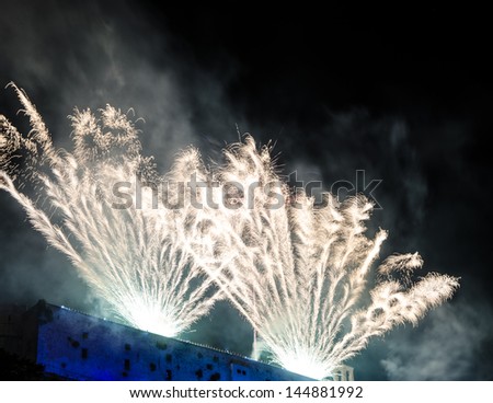 Fireworks over Malaspina Castle during White Night summer festival in Massa, Italy