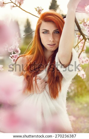 Sensual portrait of a spring woman, beautiful face, redhead