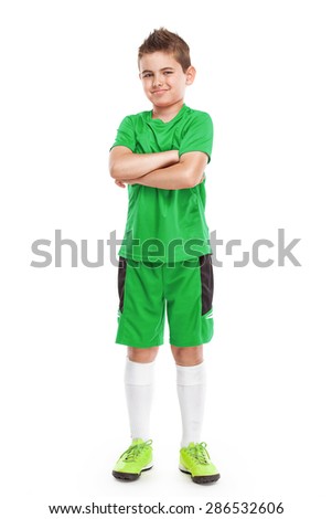 standing young soccer player in sportswear isolated over white background
