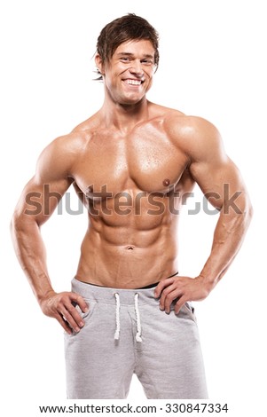 Strong Athletic Man  showing muscular body and sixpack abs over white background
