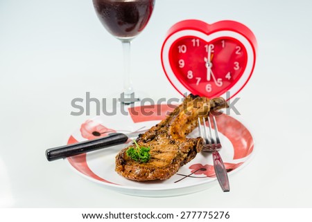 juicy grilled pork chop,Drink Wine for dinner time with heart Clock
