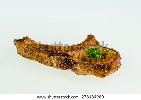 Grilled pork chop isolated on white background