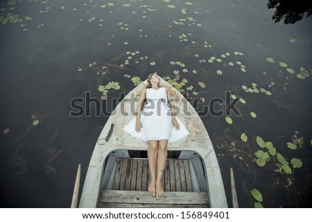woman on boat at lake