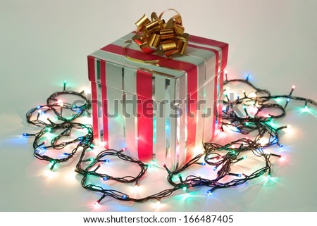 Christmas and New Year gift with bright lights garland