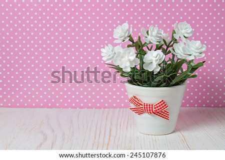 small bouquet of flowers on a colored background