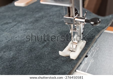 sewing machine makes a seam on leather. sewing process