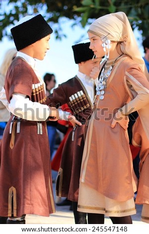 ALANYA, TURKEY - MAY 25, 2013:unidentified children in wearing national costumes before a school performance