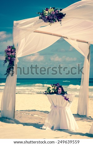 Wedding altar on the beach in Mexico with caribbean sea in the background