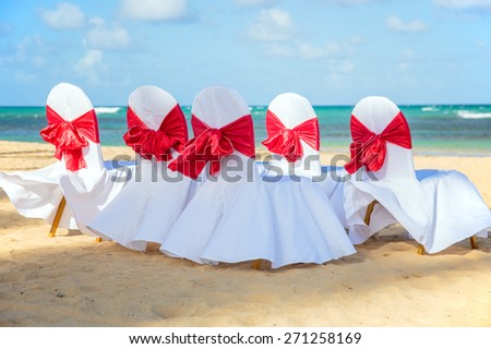 Chairs prepared for wedding event on caribbean beach