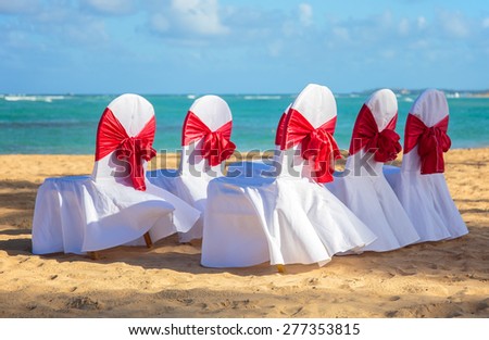 Chairs prepared for wedding event on caribbean beach
