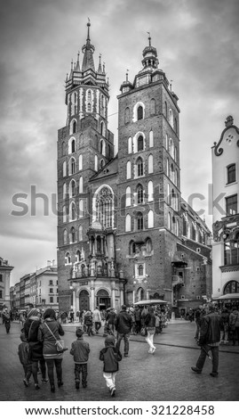 CRACOW, POLAND - MAY 01, 2015: black and white photo of Mariacki church at the Main Square in Cracow ( Krakow ), Poland