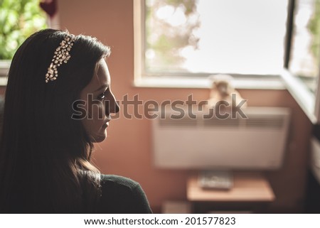 Beautiful bride to be preparing at her home, waiting. Bridal accessories for hair