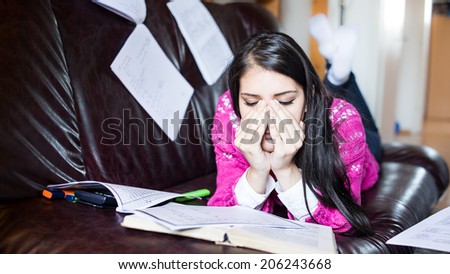 Tired student having a lot to read. Student girl with lot of books around. Student is studying. Study up.