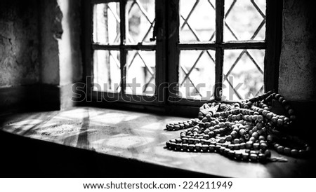 Muslim rosary beads on the mosque window, holy place of muslims. Islam prayer beads. Beads for praying