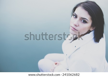 Depressed woman.Young girl depression, stress and problems, pain, female depressed.Beautiful brunette young woman with sad face. Sad expression, sad emotion,sadness. Gorgeous brunette outdoor portrait