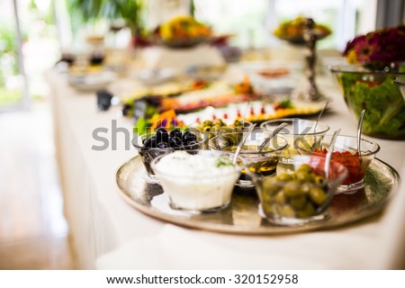 Breakfast buffet with mediterranean dips and topping, side dish. Olives and cream served for breakfast.Self-service breakfast all you can eat buffet.Hotel,canteen breakfast