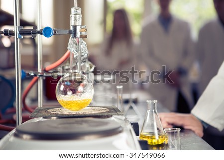 Laboratory equipment for distillation.Separating the component substances from liquid mixture with evaporation and condensation. Industrial chemistry. Pharmaceutical research. Erlemeyer flask, apparatus