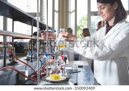 Young medicine developer pharmaceutical researcher. Woman genius chemist. University professor.Intern. Developing new medicine for psychosis and depression in laboratory with herbal extraction. Drugs