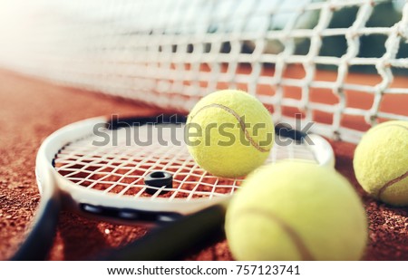 Tennis game. Tennis ball with racket on the tennis court. Sport, recreation concept