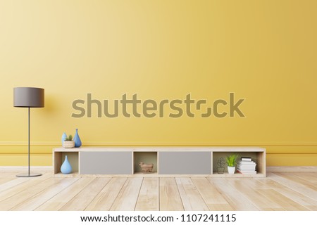 Cabinet  For TV or place object in modern living room with lamp,table,flower and plant on yellow wall background,3d rendering