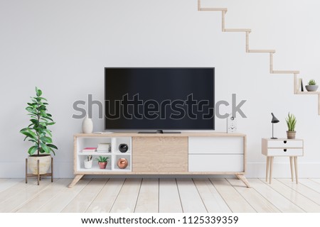 TV on the cabinet in modern living room with plants in living room with empty white wall. 3D rendering.