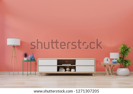 Cabinet TV in modern room with decoration on wooden living coral color wall background,3d rendering