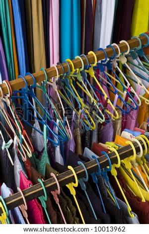 Display of colorful womans clothing on clothing rack