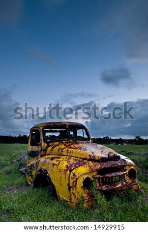 Yellow Truck Wreck in green field