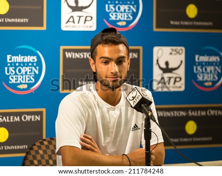 WINSTON-SALEM, NC, USA - AUGUST 16: Noah Rubin answers questions at a new conference at the Winston-Salem Open on August 16, 2014 in Winston-Salem, NC, USA