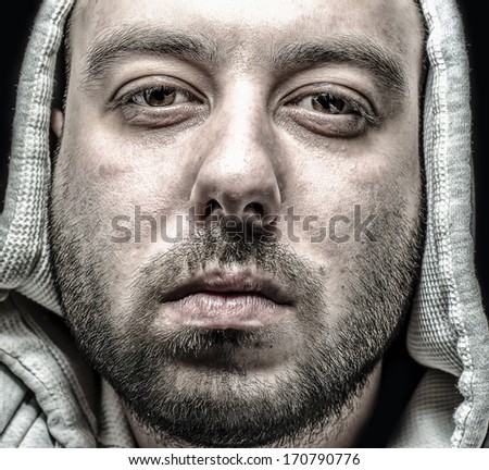 dramatic detailed portrait of a man with hood