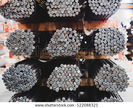 Stack of steel round bar - iron metal rail lines material for industry construction.