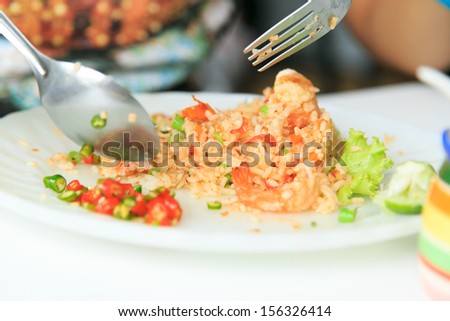 Eating chili and rice