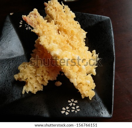 Tempura, japanese crispy shrimp on black plate