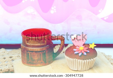 Cup cake with love letter on heart sugar paste , gradient filter