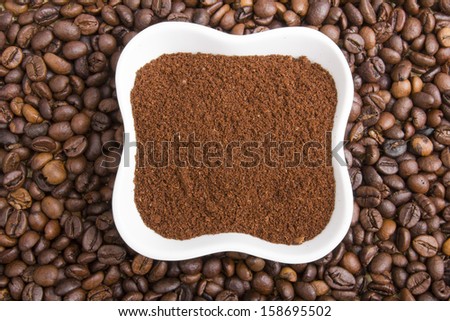 grounds coffee on coffee beans background