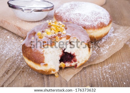 bitten donut on a wooden table