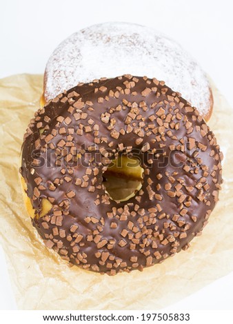 donuts with chocolate on baking paper