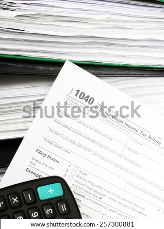 Close up U.S. Individual tax form 1040 with calculator