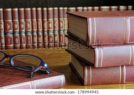 books on the table and classes and the bottom shelf