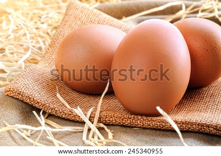 fresh eggs on a burlap bag on a table