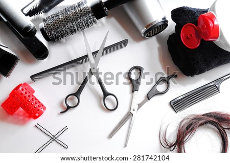 Horizontal composition hairdressing tools on a white table and white background isolated top view