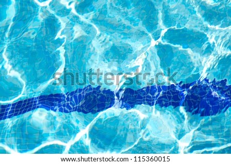 bottom of swimming pool with blue transparent water