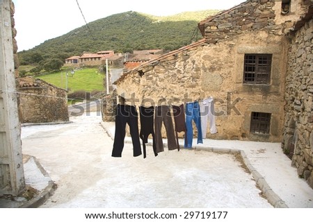 clothes hang out at a public street of collado village in avila spain
