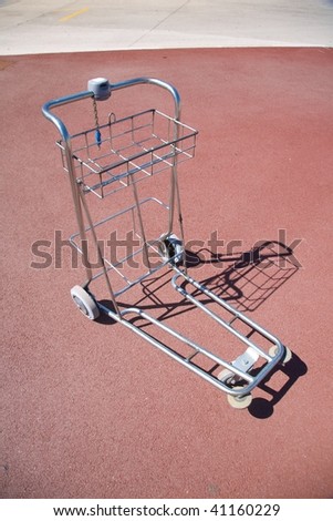 lonely luggage cart outside the lyon airport