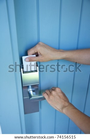 metal lock-card and handle on blue wood door