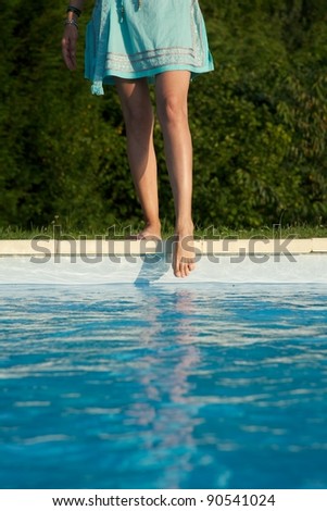 woman barefoot at swimming pool border in Asturias Spain