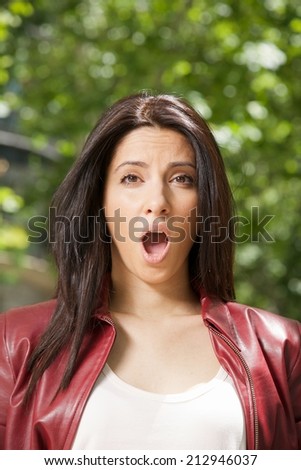 pretty woman open mouth face with red leather jacket