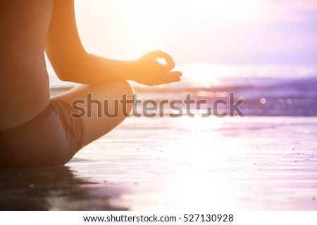 Young man make meditation in lotus pose, yoga and wellness concept.
