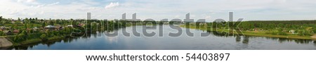 Panorama of a summer landscape with the river,wood and Totma-city. River - Suhona - big river in Vologda region (Russia) Panoramic image from several pictures. The file has native resolution.